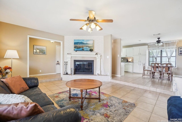 140 Should Bee, Ingram, TX 78025 - living room with a ceiling fan, light tile patterned floors, a fireplace, and baseboards