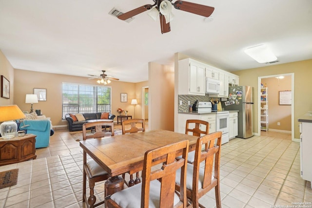 140 Should Bee, Ingram, TX 78025 - dining area featuring a ceiling fan, light tile patterned flooring, and baseboards