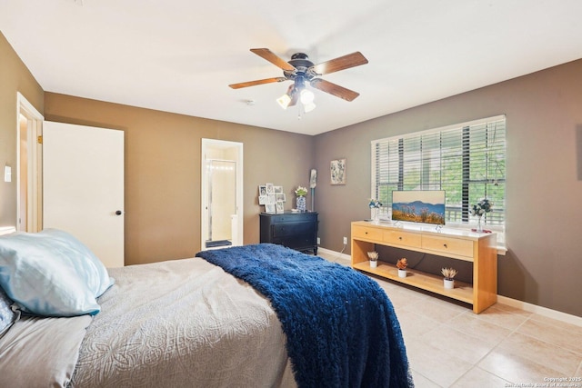 140 Should Bee, Ingram, TX 78025 - bedroom with baseboards, light tile patterned floors, ceiling fan, and ensuite bath