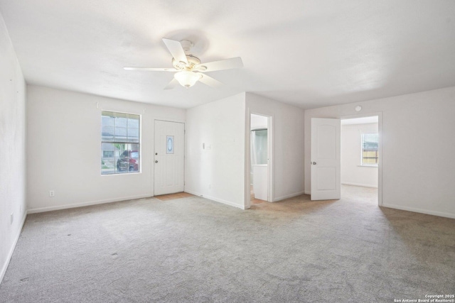 140 Should Bee, Ingram, TX 78025 - unfurnished living room with healthy amount of natural light, carpet floors, and ceiling fan