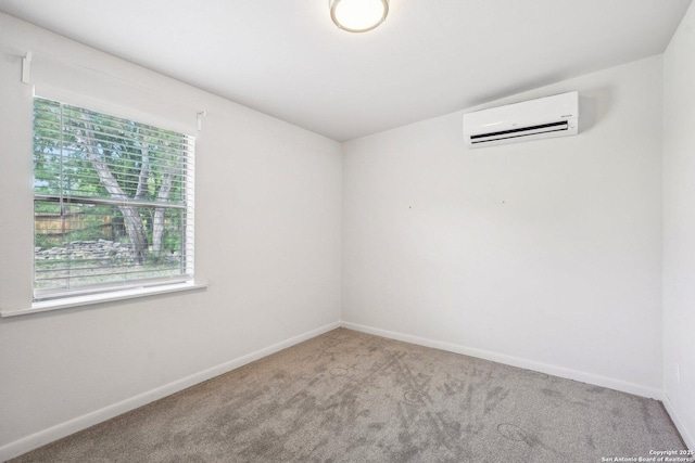 140 Should Bee, Ingram, TX 78025 - empty room with a wall mounted AC, carpet floors, and baseboards