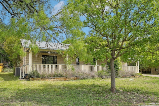 140 Should Bee, Ingram, TX 78025 - view of front facade with covered porch, a front lawn, and cooling unit