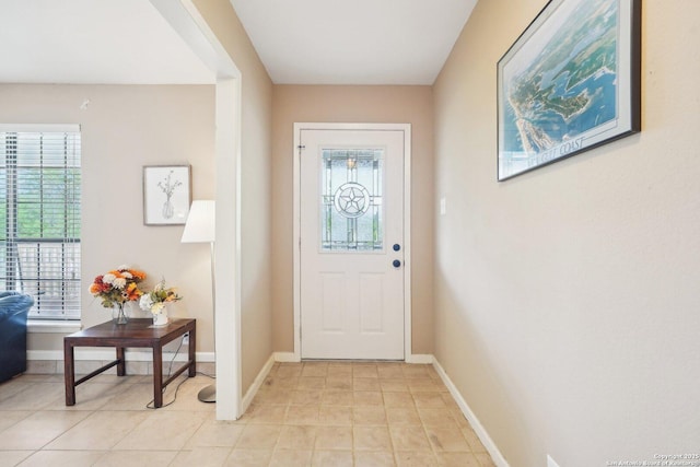 140 Should Bee, Ingram, TX 78025 - doorway to outside featuring baseboards and light tile patterned flooring