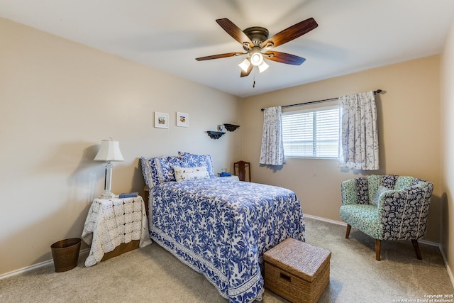 carpeted bedroom with baseboards and ceiling fan