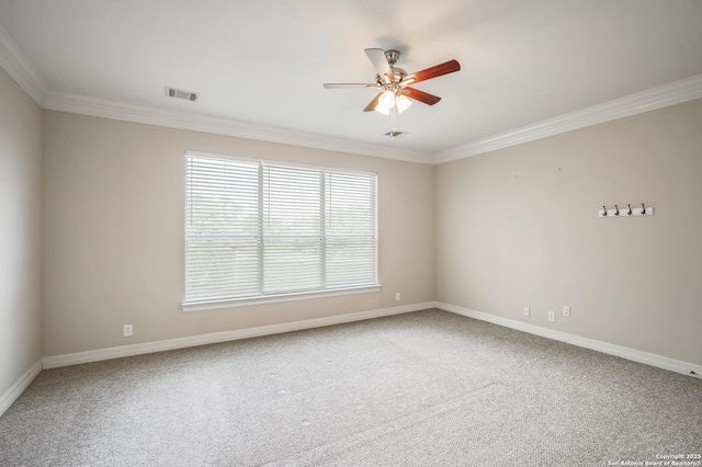 empty room with crown molding, ceiling fan, carpet, and baseboards