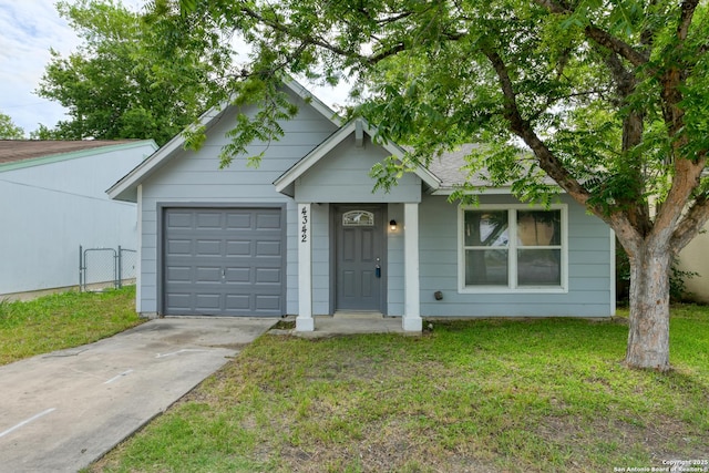 4342 Lehman Dr, Kirby, TX 78219 - view of front of home with an attached garage, a front lawn, and driveway
