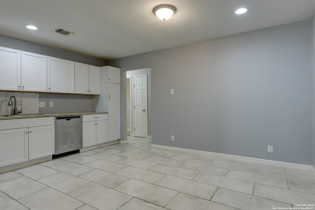 4342 Lehman Dr, Kirby, TX 78219 - kitchen with dishwasher, a sink, white cabinets, recessed lighting, and baseboards
