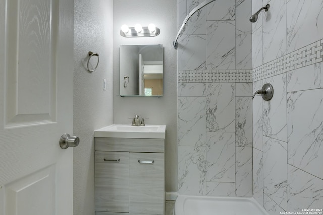 4342 Lehman Dr, Kirby, TX 78219 - bathroom featuring vanity, a shower, and a textured wall