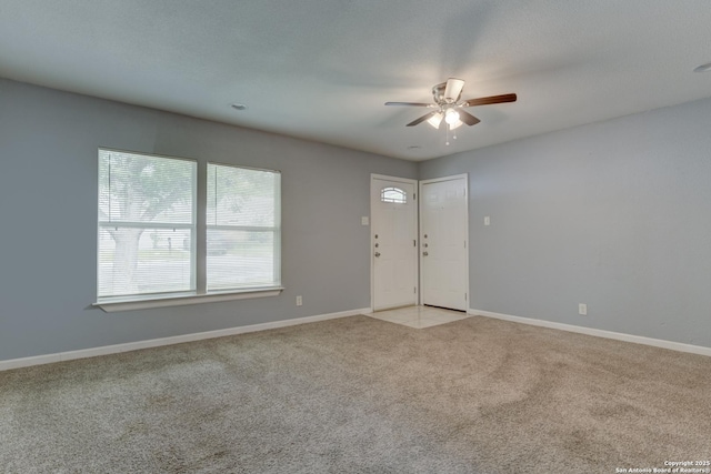 4342 Lehman Dr, Kirby, TX 78219 - entryway featuring a ceiling fan, light carpet, and baseboards