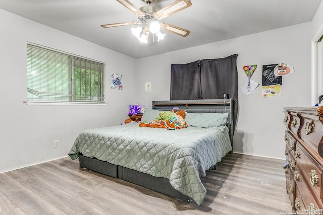 5118 Crusade Dr, San Antonio, TX 78218 - bedroom with wood finished floors, baseboards, and ceiling fan