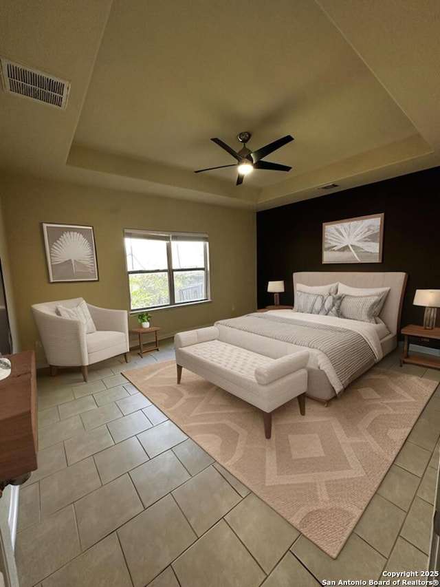 6635 Cibola Frst, San Antonio, TX 78233 - bedroom featuring a raised ceiling, light tile patterned floors, and ceiling fan