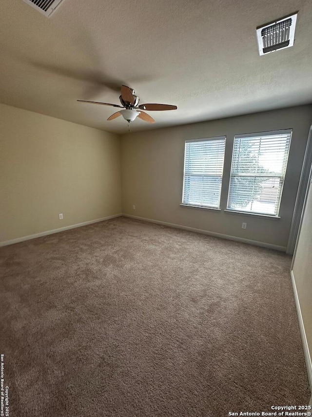 6635 Cibola Frst, San Antonio, TX 78233 - spare room featuring carpet flooring, baseboards, a ceiling fan, and a textured ceiling