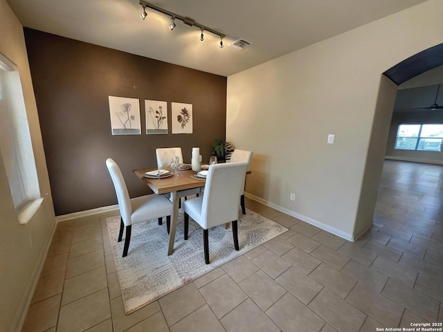 6635 Cibola Frst, San Antonio, TX 78233 - dining room with track lighting, tile patterned floors, and baseboards