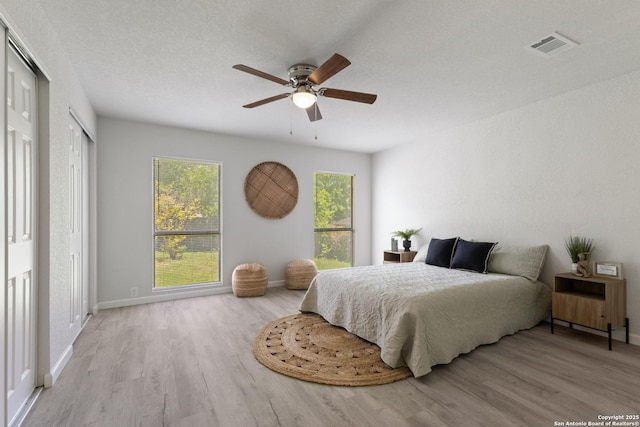 3115 Bluefield, San Antonio, TX 78230 - bedroom with wood finished floors, baseboards, and a ceiling fan