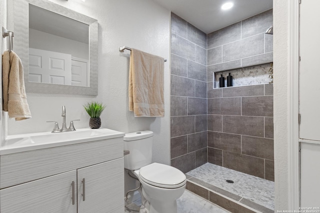 3115 Bluefield, San Antonio, TX 78230 - full bathroom featuring toilet, a tile shower, and vanity