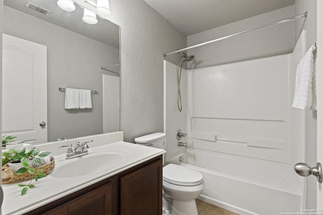 10307 Royal, San Antonio, TX 78245 - bathroom with a textured wall, toilet, vanity, shower / washtub combination, and tile patterned floors