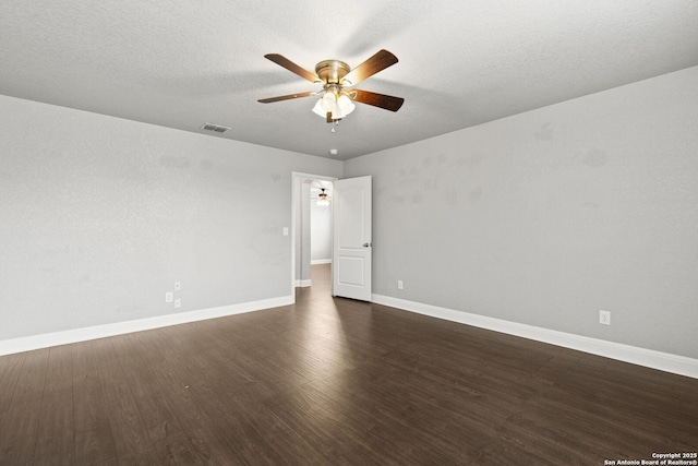 10307 Royal, San Antonio, TX 78245 - empty room with a ceiling fan, dark wood-style floors, baseboards, and a textured ceiling