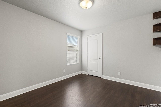 10307 Royal, San Antonio, TX 78245 - spare room featuring dark wood-style floors and baseboards