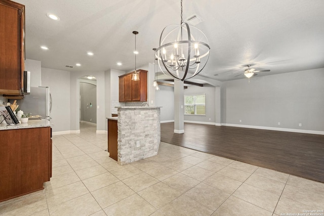 10307 Royal, San Antonio, TX 78245 - kitchen featuring arched walkways, ceiling fan, a chandelier, light tile patterned floors, and recessed lighting
