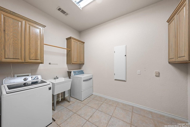 2001 Crown Rdg, Kerrville, TX 78028 - laundry area featuring cabinet space, baseboards, and light tile patterned flooring