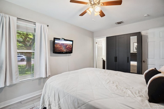 3003 Shady Spgs, San Antonio, TX 78230 - bedroom with baseboards, wood finished floors, and a ceiling fan
