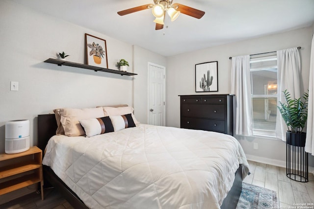 3003 Shady Spgs, San Antonio, TX 78230 - bedroom with wood finished floors, ceiling fan, and baseboards