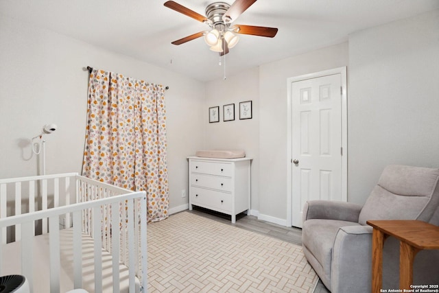 3003 Shady Spgs, San Antonio, TX 78230 - bedroom featuring a crib and a ceiling fan