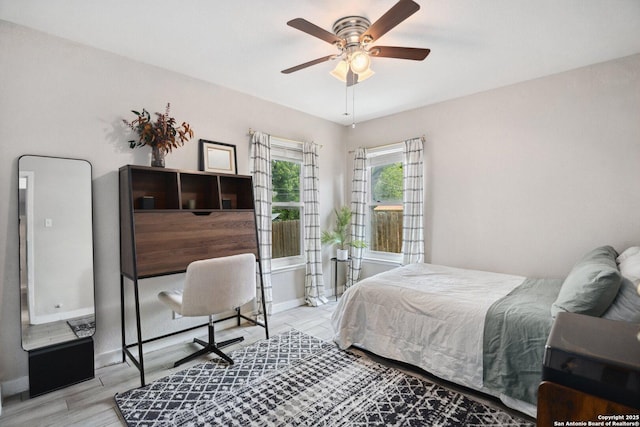 3003 Shady Spgs, San Antonio, TX 78230 - bedroom featuring wood finished floors, baseboards, and a ceiling fan