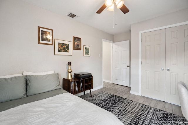 3003 Shady Spgs, San Antonio, TX 78230 - bedroom with wood finished floors, baseboards, a closet, and a ceiling fan