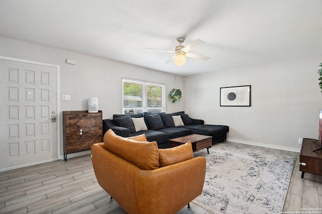 3003 Shady Spgs, San Antonio, TX 78230 - living room with a ceiling fan, light wood-style floors, and baseboards