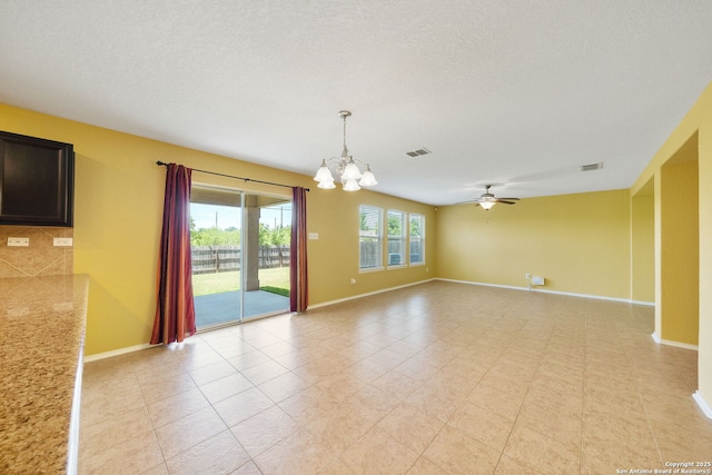 7923 Martinelli, San Antonio, TX 78253 - empty room with a chandelier, baseboards, and a ceiling fan