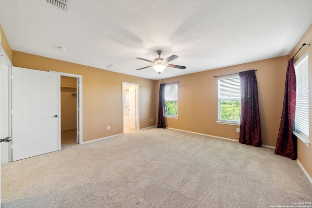 7923 Martinelli, San Antonio, TX 78253 - unfurnished bedroom featuring carpet, a spacious closet, baseboards, and ceiling fan