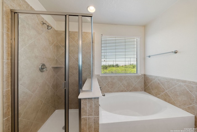 7923 Martinelli, San Antonio, TX 78253 - full bathroom featuring a shower stall, a bath, and recessed lighting