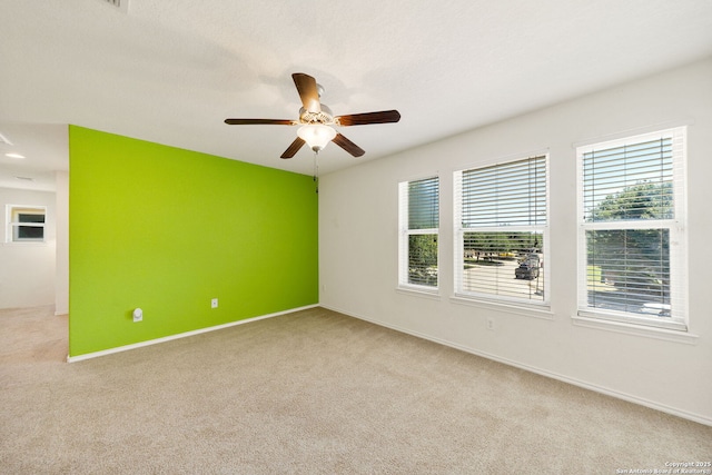 7923 Martinelli, San Antonio, TX 78253 - empty room featuring light carpet, ceiling fan, and baseboards