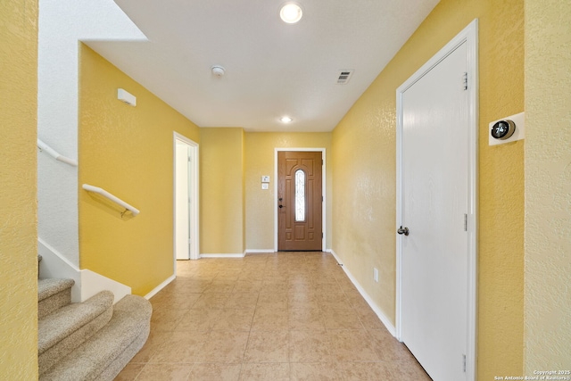 7923 Martinelli, San Antonio, TX 78253 - foyer entrance with baseboards, recessed lighting, a textured wall, and light tile patterned flooring