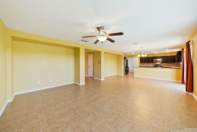 7923 Martinelli, San Antonio, TX 78253 - unfurnished living room featuring a chandelier, ceiling fan, baseboards, and light tile patterned floors