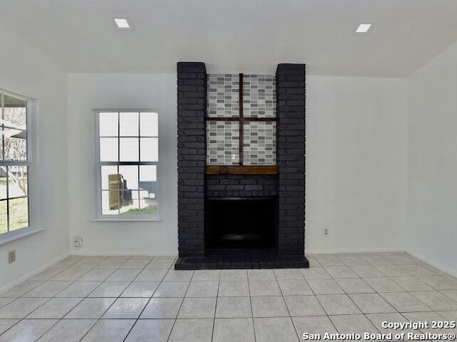 5530 Rangeland, San Antonio, TX 78247 - unfurnished living room with tile patterned floors, a fireplace, and baseboards