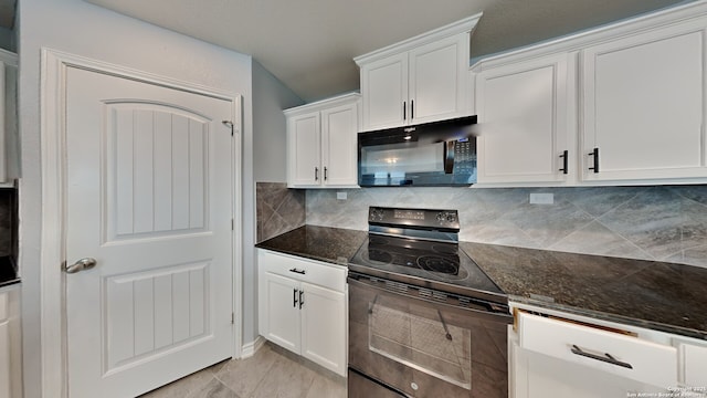 7918 Hanging, San Antonio, TX 78253 - kitchen featuring black appliances, white cabinetry, backsplash, and dark stone counters