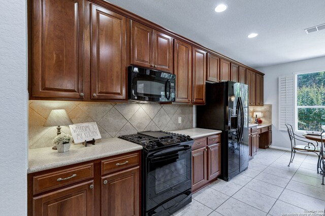 4602 Fort Boggy, San Antonio, TX 78253 - kitchen featuring black appliances, recessed lighting, backsplash, light countertops, and light tile patterned floors