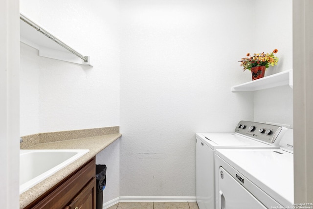 4602 Fort Boggy, San Antonio, TX 78253 - laundry area featuring separate washer and dryer, baseboards, light tile patterned flooring, and cabinet space
