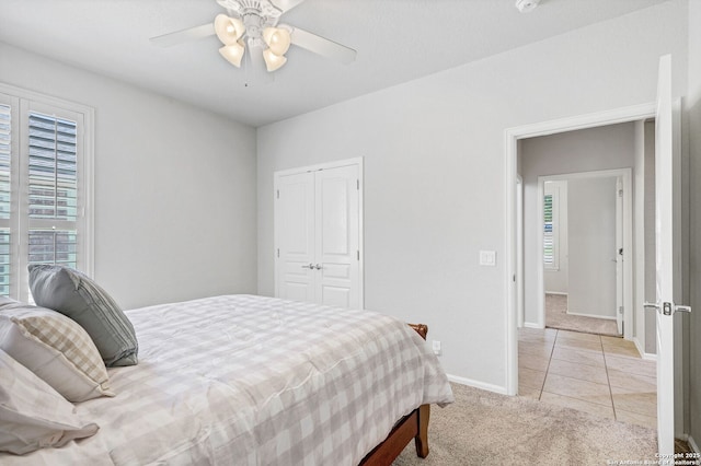 4602 Fort Boggy, San Antonio, TX 78253 - bedroom featuring light carpet, multiple windows, baseboards, and a closet