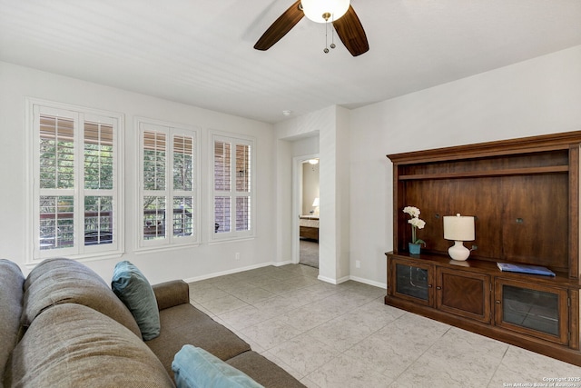 4602 Fort Boggy, San Antonio, TX 78253 - living area featuring a ceiling fan, light tile patterned floors, and baseboards