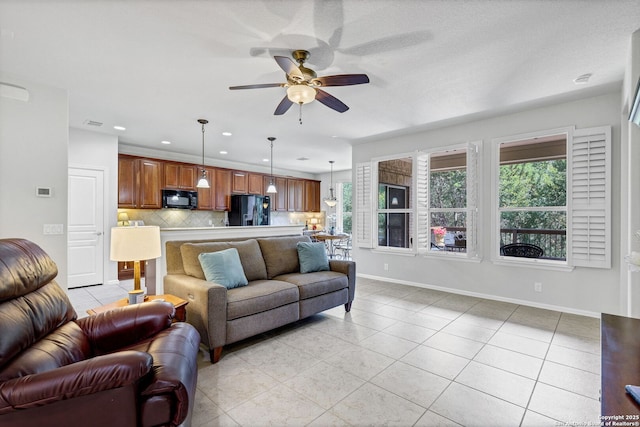 4602 Fort Boggy, San Antonio, TX 78253 - living room with light tile patterned floors, ceiling fan, baseboards, and recessed lighting
