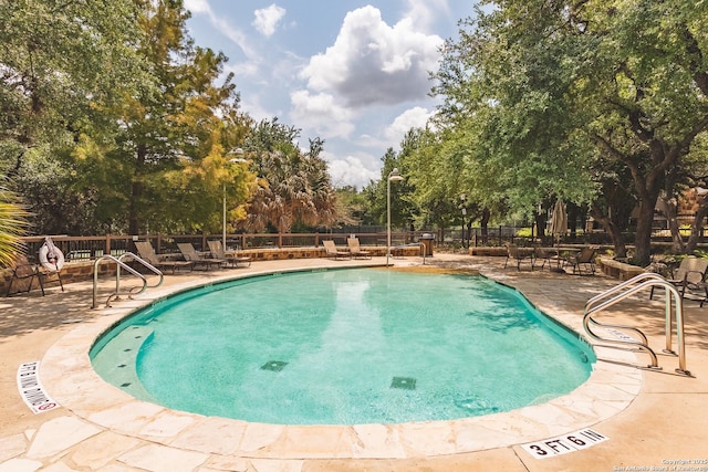 5015 Country Nest, San Antonio, TX 78253 - community pool with a patio, fence, and view of wooded area
