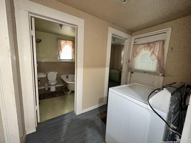 2222 Osburn, San Antonio, TX 78208 - laundry area featuring washer / clothes dryer and a textured ceiling