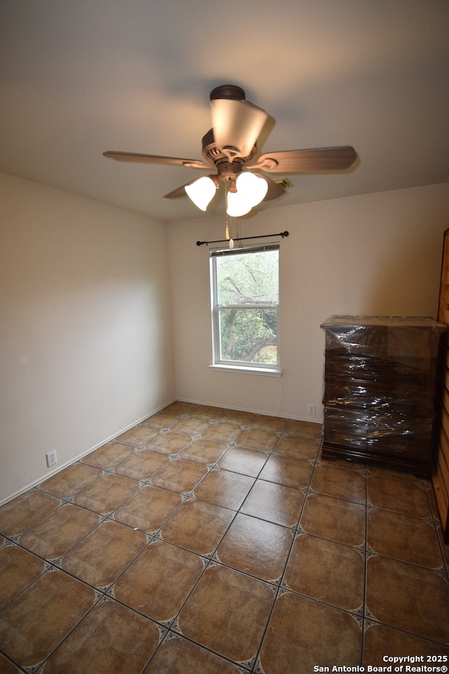 unfurnished room featuring ceiling fan