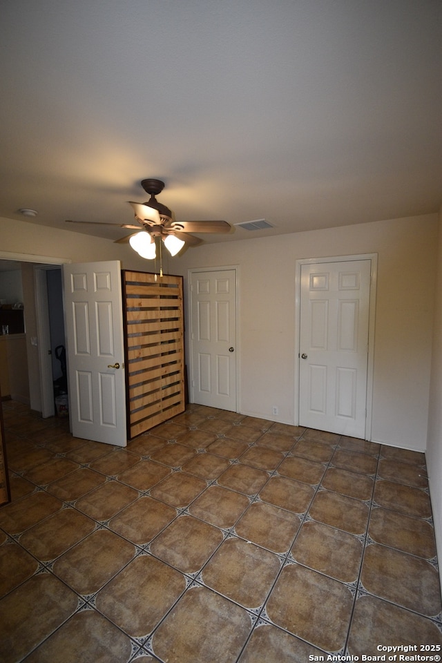 unfurnished bedroom with a closet and a ceiling fan