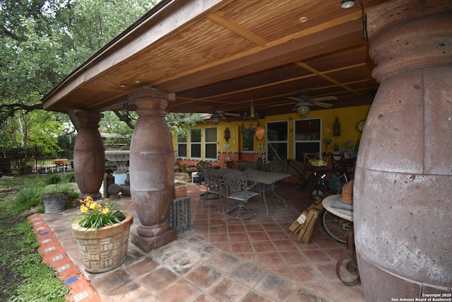 view of patio / terrace with outdoor dining space and a ceiling fan