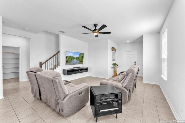 15836 Selene, San Antonio, TX 78245 - living area featuring light tile patterned floors, stairway, healthy amount of natural light, and a ceiling fan