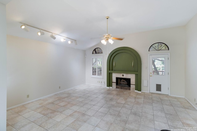 5919 Cedar Path, San Antonio, TX 78249 - unfurnished living room featuring a ceiling fan, light tile patterned floors, healthy amount of natural light, and a tile fireplace
